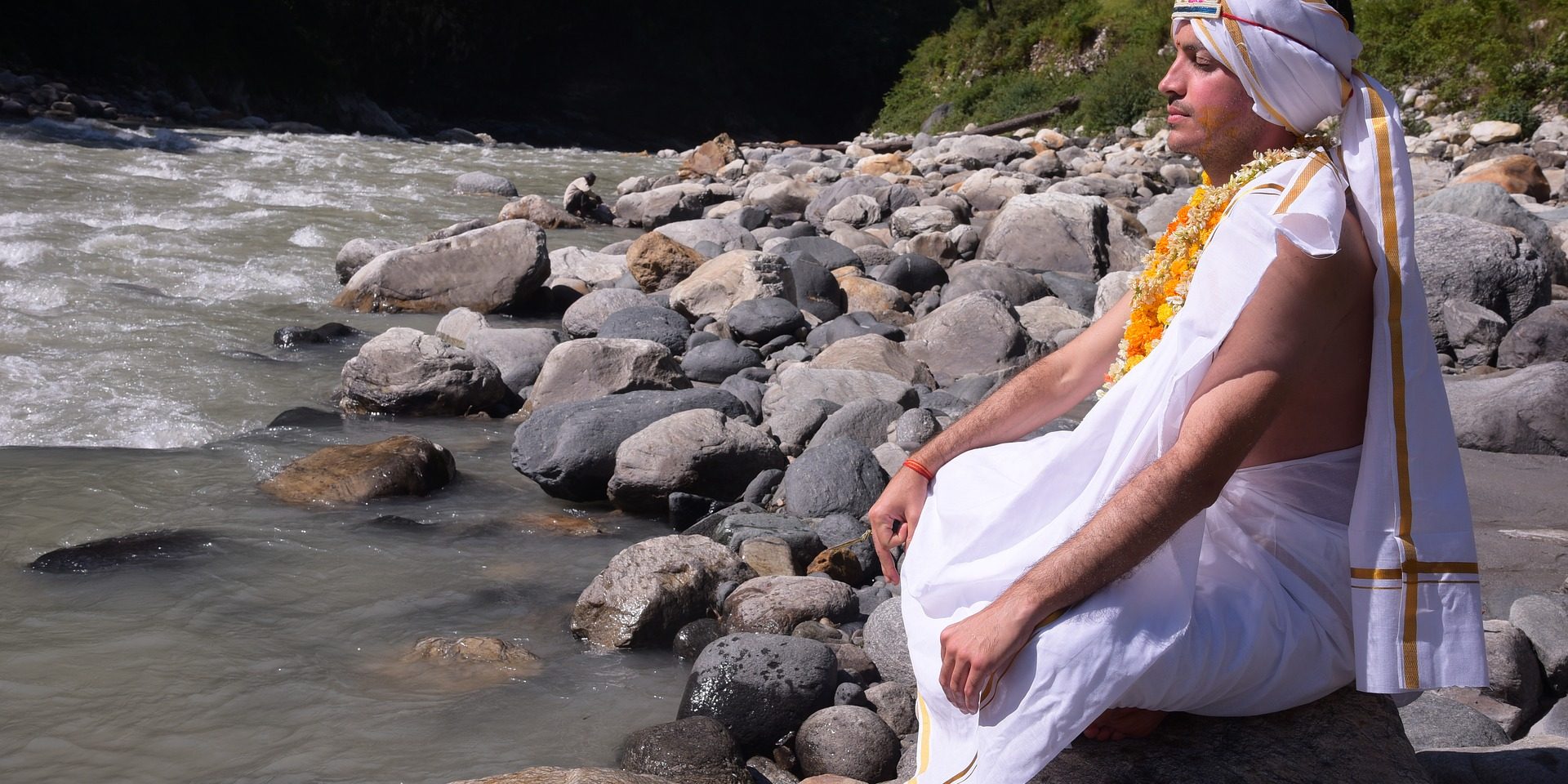 Person doing meditation at ganga in rishikesh